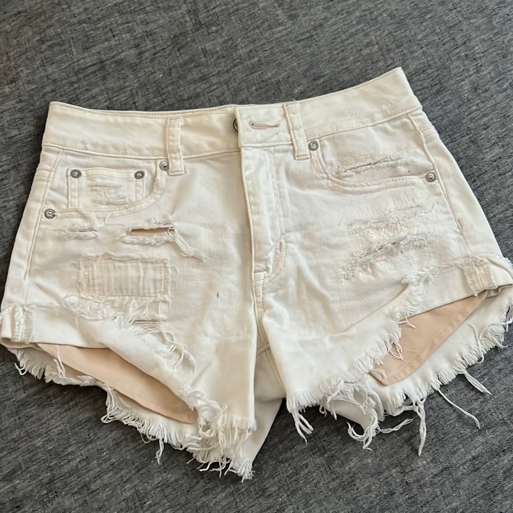 AE white distressed denim shorts